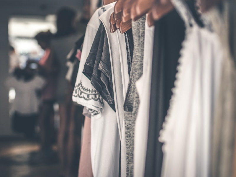 Photo of vintage dresses hanging on clothing rack