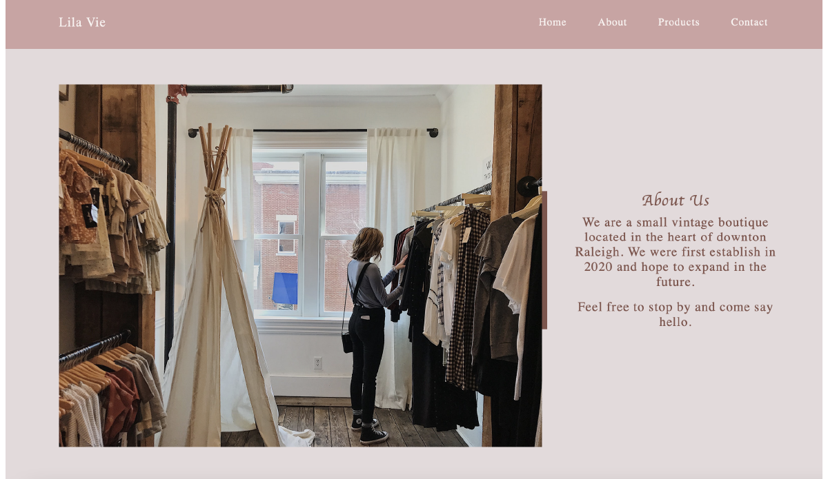 Photo of woman looking through clothes hanging on a clothing rack